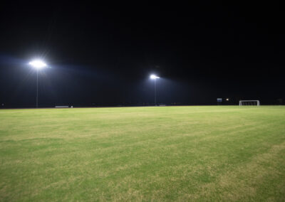 The Bayou Academy soccer field is brightly lit at night