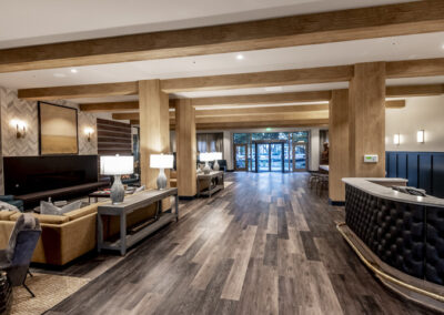 The Cotton House indoor view of industrial style chandeliers and tables, with lighting created by Robinson Electric