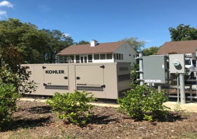 A large Kohler generator outside a home