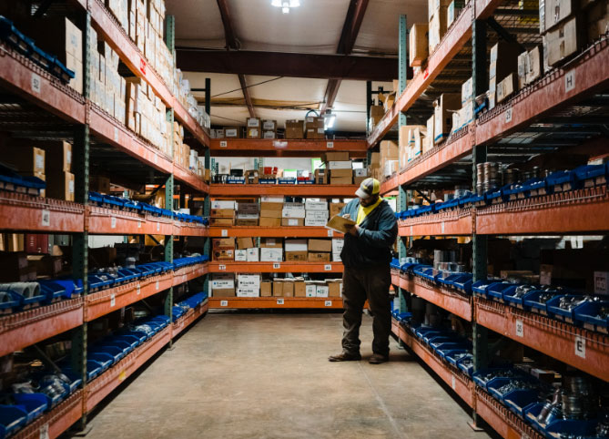 A Robinson Electric employee takes stock in a large warehouse