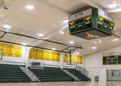 The Pillow Academy high school gymnasium is professionally lit and has an impressive scoreboard by Robinson Electric.