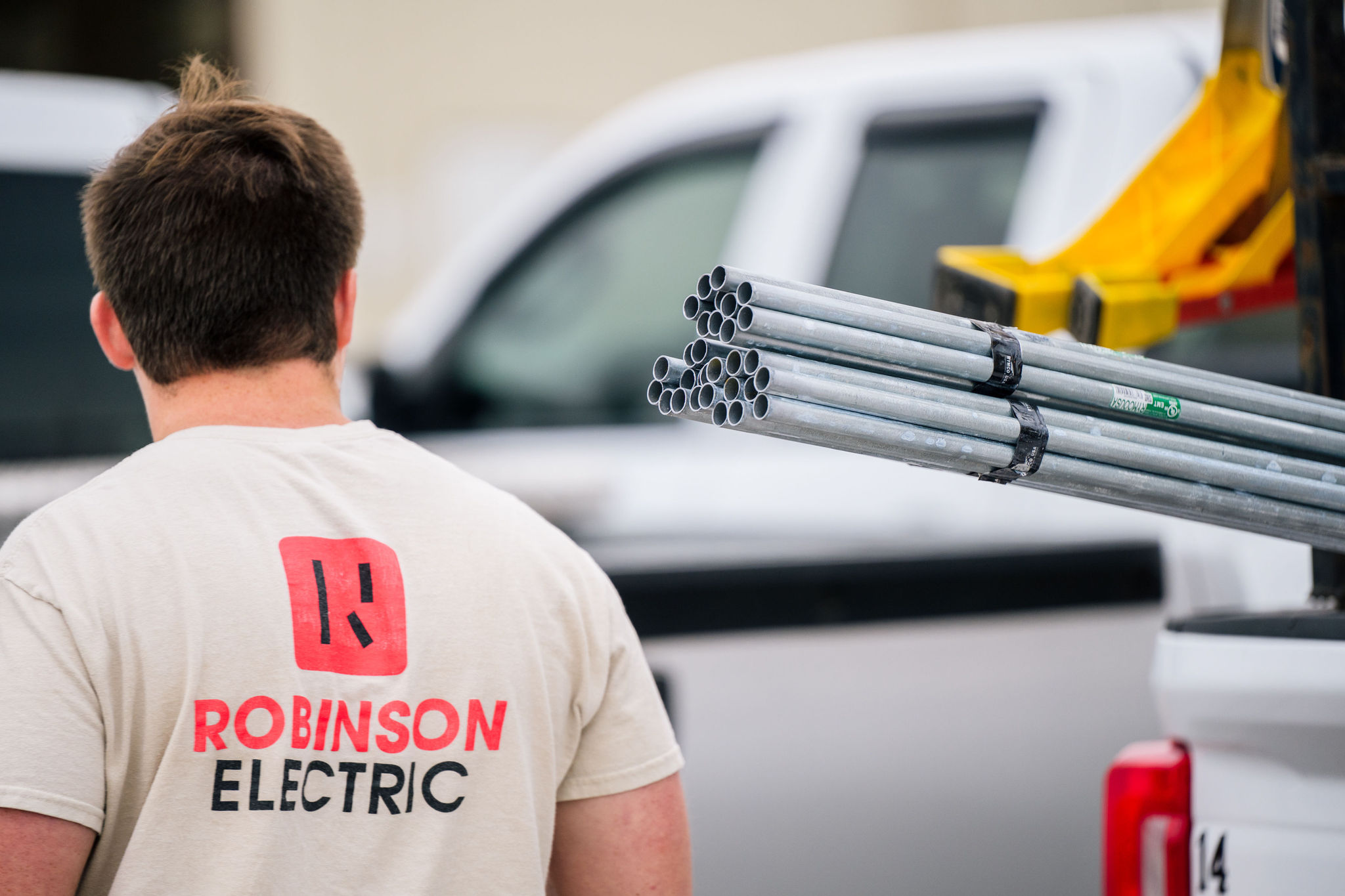 A Robinson Electric employee takes stock in a large warehouse