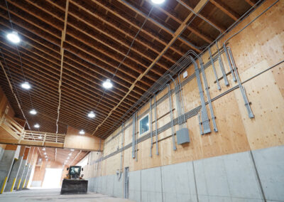 An interior view of a big warehouse with great lighting at the Simplot Grower Solutions Dry Fertilizer Terminal.