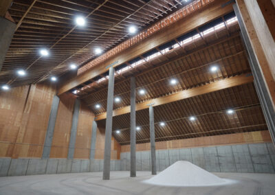 An interior view of a big warehouse with great lighting at the Simplot Grower Solutions Dry Fertilizer Terminal.